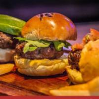 Al Carbon Sliders · Three sliders with side of guacamole and cheddar sauce. Accompanied with potato chips, lettu...