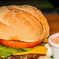 Cheese Burger · Stuffed with swiss cheese. Accompanied with potato chips, lettuce, and sliced tomato.