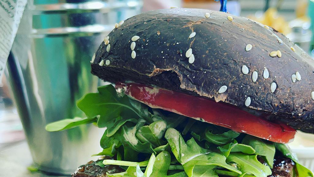The Chef'S · Stuffed with goat cheese, arugula,tomato,caramelized onions,cilantro mayo in our black butter bun.