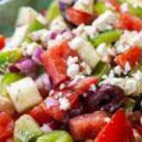 Greek Salad · Most popular. Romaine and iceberg lettuce, tomatoes, cucumbers, olives, onions stuffed grape...