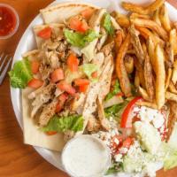 Chicken Gyro Plate · Sliced grilled chicken breast served in a pita with a side Greek salad, Greek fries, and hom...