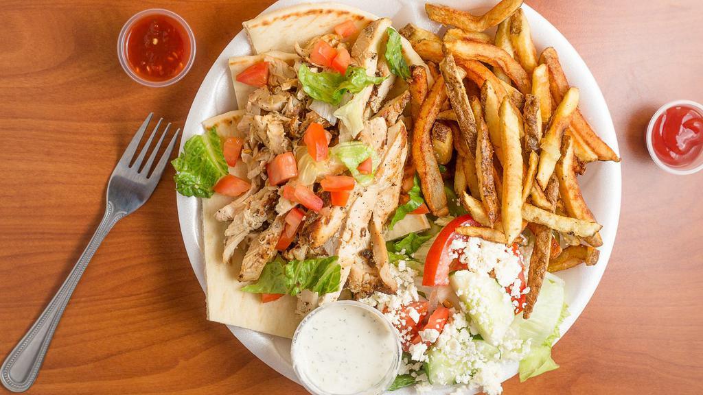 Chicken Gyro Plate · Sliced grilled chicken breast served in a pita with a side Greek salad, Greek fries, and homemade tzatziki sauce.