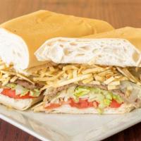 Pan Con Bistec · Steak sandwich. Grilled with onions julienne fries and garnished with tomatoes and lettuce o...