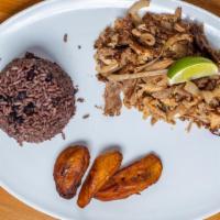Lechon · Grilled pulled pork with sauteed onions.