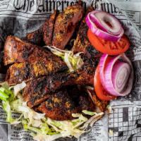 Chicken Suya · Famously irresistible African street food Chargrilled succulent quarter chicken marinated in...