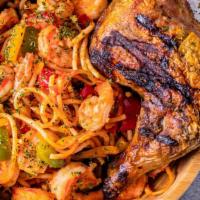 Jollof Spaghetti Stir Fry · Spaghetti stir fired in smoky tomato and red pepper sauce,  mixed vegetables with added praw...