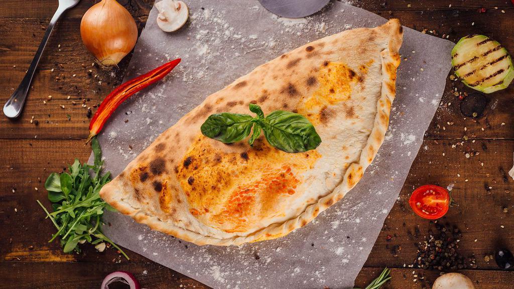 Calzone With Meatballs And Mushrooms · Mouthwatering 16 inch calzone stuffed with Meatballs, mushrooms, and Ricotta and Mozzarella Cheese.