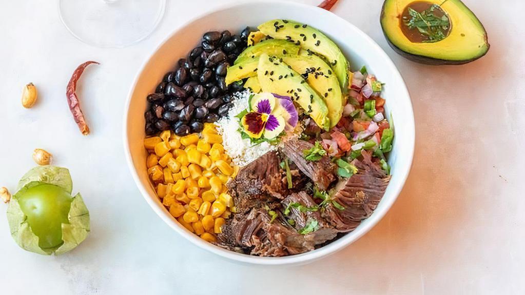 Burrito Rice Bowl · Rice, avocado, corn, pico de gallo, black beans, and cheese.