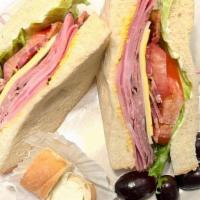 Club Sandwich · Smoked turkey, honey ham, applewood bacon, american and swiss cheese, mustard and mayo on yo...