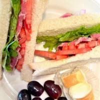 Ahi Tuna Sandwich · Sashimi grade Ahi tuna seared to perfection. Served with tomato, lettuce, red seedless grape...
