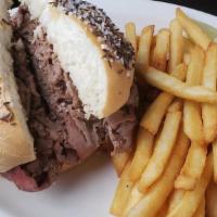 Roast Beef On Weck · Anchor Bar Signature Items. Slow roasted, thinly sliced roast beef piled high and served on ...