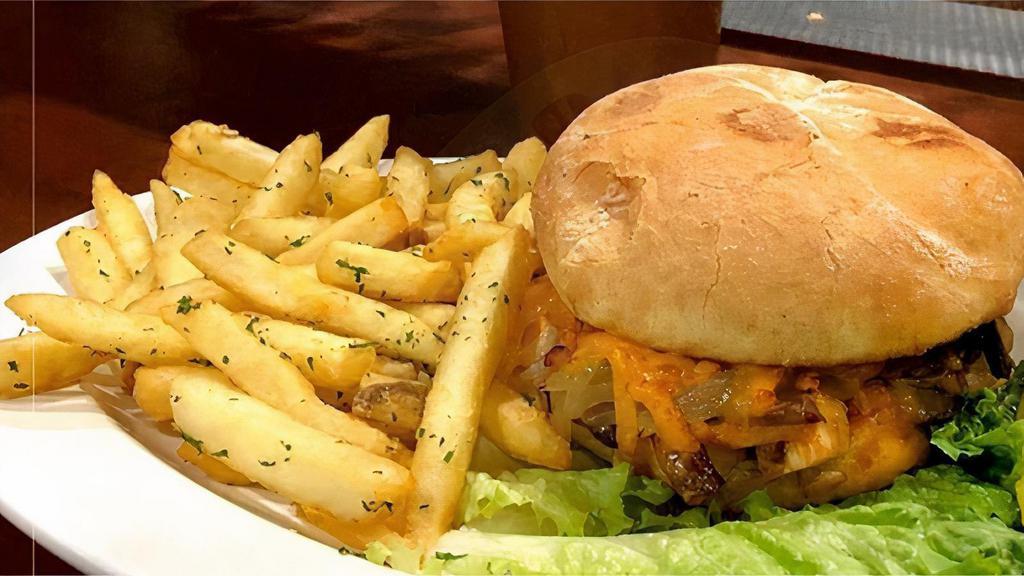 Impossible Burger · A 1/4 lb veggie burger topped with lettuce, tomato, and onion served with a side of French fries. Served with French fries and a pickle spear.