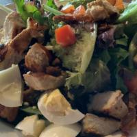 Cobb Salad · Mixed greens topped with crumbly bleu, avocado, egg, bacon, tomatoes and grilled chicken wit...
