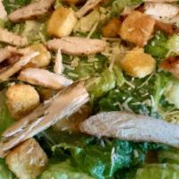 Chicken Caesar Salad · Crisp romaine lettuce with croutons and parmesan cheese, tossed in a creamy Caesar dressing.