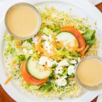 Garden Salad · Crisp romaine lettuce, cucumber, tomato served with house prince dressing.
