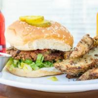 Garvey Burger · Our famous homemade burger made from seasoned wheat roast, topped with romaine lettuce, toma...