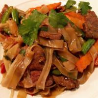 Spicy Drunken Man Noodle · Stir fried flat noodle with a choice of proteins,
Kee Mao sauce, bell pepper, onion, snap be...