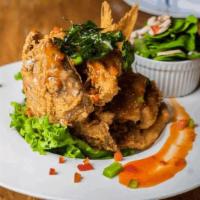 Chao Pra-Yah Whole Red Snapper · Breaded fried a whole red snapper, shrimp,
topped with spicy red curry paste, served
with st...