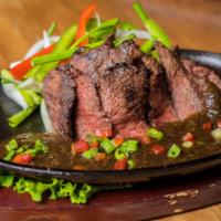 Pepper Steak · Grilled 12 oz. ribeye steak, topped with
pepper sauce, served on the sizzling
hot plate and ...