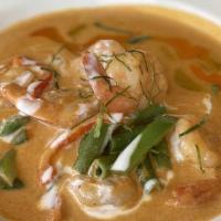 Panang Shrimp And Scallops · Seared Maines scallop and shrimp
on top with creamy and nutty Panang sauce,
served with a si...