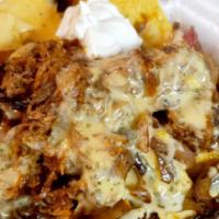 Roast Pulled Pork Nachos · Tender slow cooked shredded pork tossed in house BBQ sauce, grilled peppers and onions, hous...