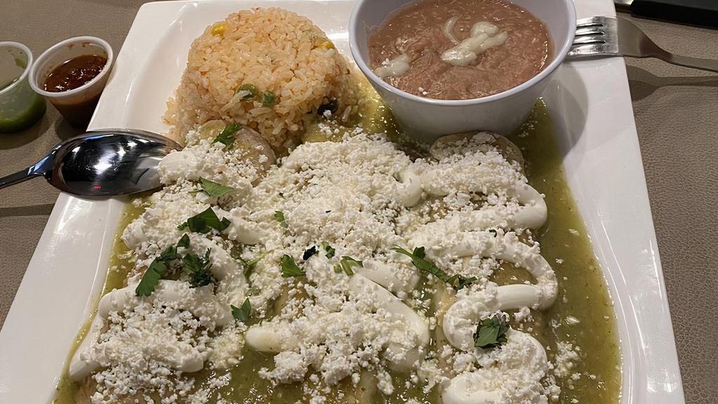Enchiladas Verdes Con Pollo · 3 tortillas stuffed with chicken topped with green tomatillo sauce, sour cream and Mexican cheese. Side of rice and beans.