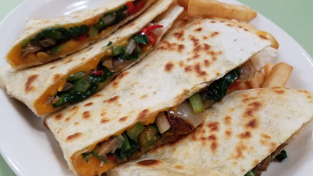 Veggie Quesadilla · Grilled peppers, onions, spinach, mushrooms & cheddar cheese served in a grilled tortilla with sour cream & a side of fries