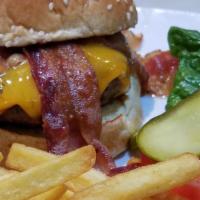 Bacon Cheese Burger · Half a pound of angus beef char-grilled and topped with bacon and American cheese. Served on...