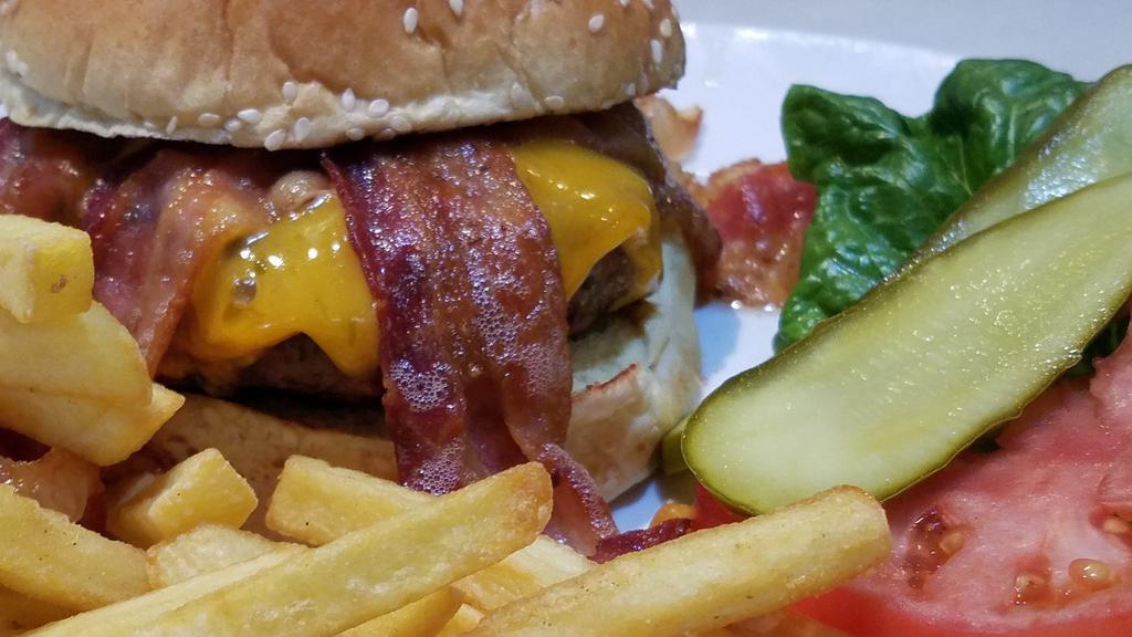 Bacon Cheese Burger · Half a pound of angus beef char-grilled and topped with bacon and American cheese. Served on a bun with lettuce, tomato, & fries.