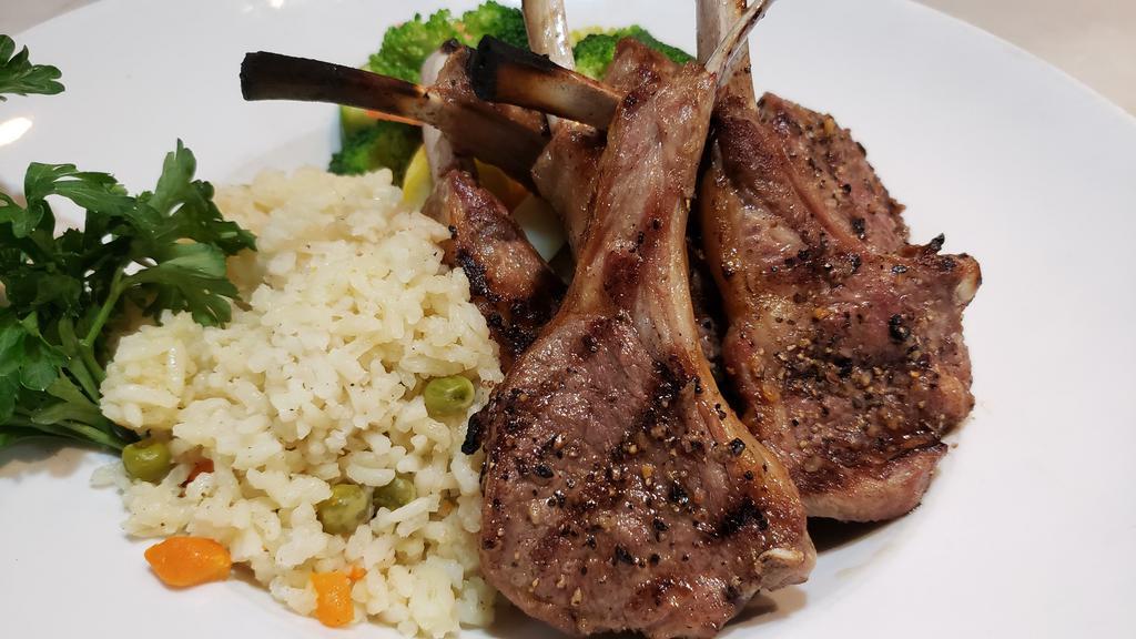 Grilled Lamb Chops · 6 grass fed New Zealand lamb chops served with rice pilaf and mixed vegetables.