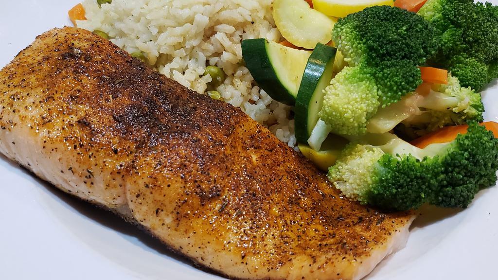Blackened Filet Of Salmon · Served with rice pilaf and mixed vegetables.