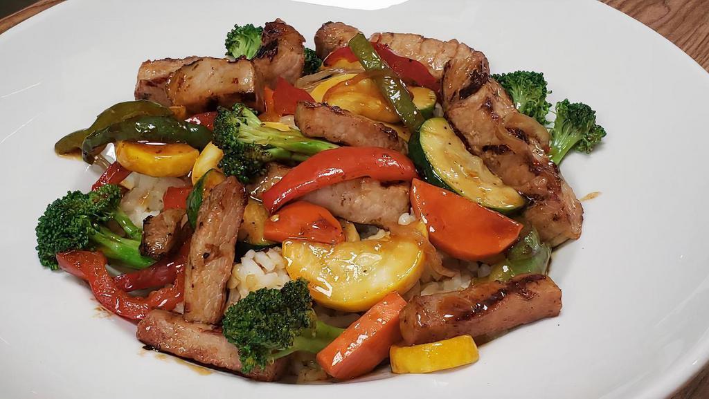 Chicken Stirfry · Chicken breast sauteed in a stir-fry sauce with peppers, onions, mixed vegetables, and served over rice.