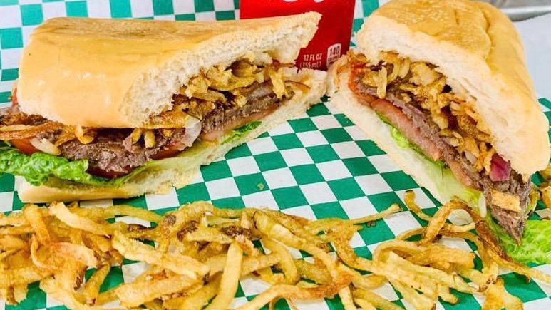 Steak Sandwich-Pan Con Bistec · With onions, lettuce, tomatoes, and julienne fries. (cebolla, lechuga, tomate y papas Juliana).