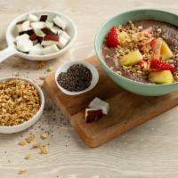 Mama Chia · Chocolate flavored chia seeds pudding, topped with strawberries, pineapples, and granola. Ca...