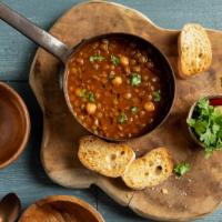Harira · Popular Moroccan soup, mildly spicy and full of flavor, served with a side of bread.