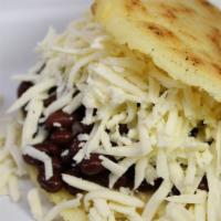 Arepa Domino · Arepa stuffed with black beans and organic shredded white cheese