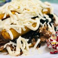 Pabellón Cachapa · Traditional Venezuelan sweet corn meal pancake with soft white cheese and shredded beef, bla...