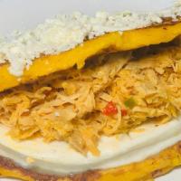Shredded Chicken Cachapa · Traditional Venezuelan sweet corn meal pancake with soft white cheese and shredded chicken