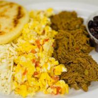 Desayuno Criollo · Scrambled eggs with tomatoes, onions, choice of shredded beef or chicken, black beans, shred...