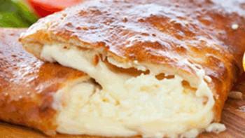 Cheese Calzone · Cheese and Marinara sauce stuffed in a freshly baked crust.  Mama Mia!