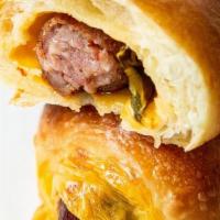 Kolache Jalepeno · Conecuh sausage, jalapeño & cheese, wrapped and baked in our brioche dough
