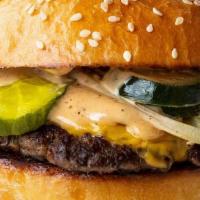 Hero Burger · All beef patty, American cheese, onion, pickle, cracked sauce.