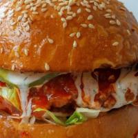 Buffalo Super Crunch · Crunchy fried chicken breast, buffalo sauce, pickles, shredded iceberg, ranch
