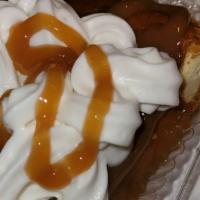 Caramel Delight · Creamy cheesecake topped with caramel, served with whipped cream.