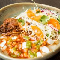 Chicken Pozole Bowl · The traditional hominy corn soup topped with spicy 3 chile chicken, radishes, avocado, and h...