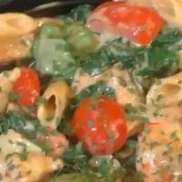 Metro Pasta · Jumbo Shrimp, Sausage, Chicken, Spinach, and Roma Tomatoes over Penne Pasta in a Spicy Alfre...