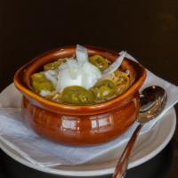 Pub Chili · Rich beef chili with beans topped with a dollop of sour cream, shredded cheddar jack
cheese ...