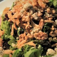 Cranberry Walnut Salad · A fresh mix of salad greens, walnuts and dried cranberries topped with bleu cheese
crumbles ...