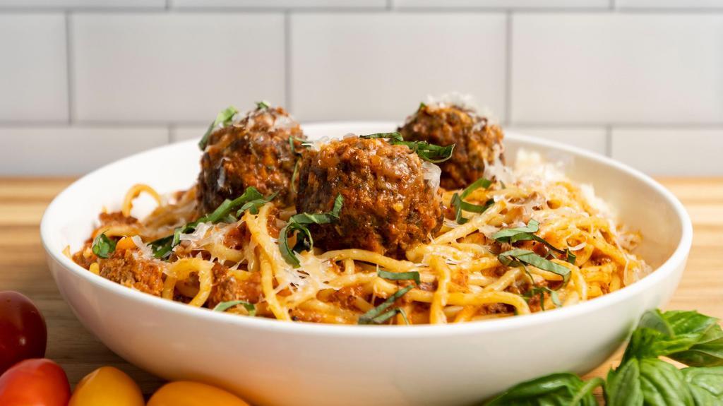 Spaghetti Bolognese With Meatballs · Spaghetti pasta with 100% beef bolognese sauce topped with three meat balls and parmesan cheese.