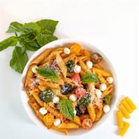 Penne Siciliana · Penne pasta with fresh pomodoro sauce, baked eggplant cubes, fresh mozzarella pearls, and ou...